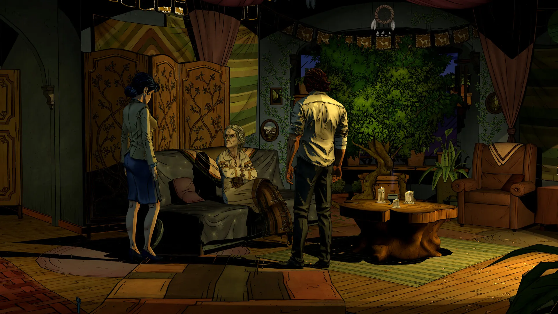 Wide shot of a cluttered apartment with patterned walls, a large potted plant, and two figures standing near a coffee table.